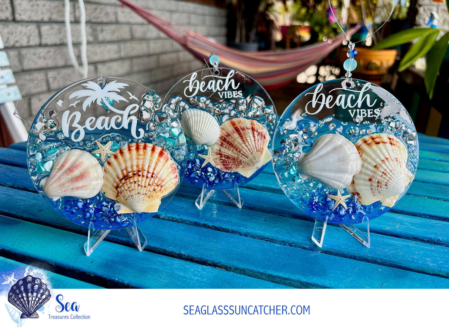 Three seaglass suncatchers with shells and 'Beach Vibes' text on a blue surface.