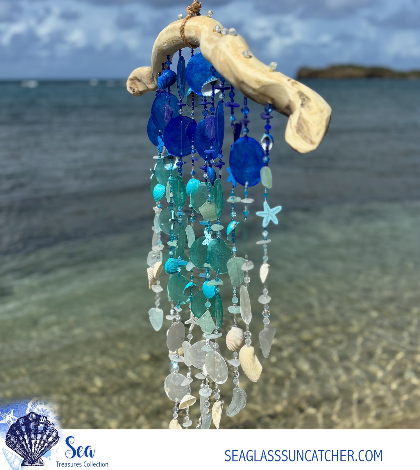 Decorative wind chime with blue and white sea glass against a beach background