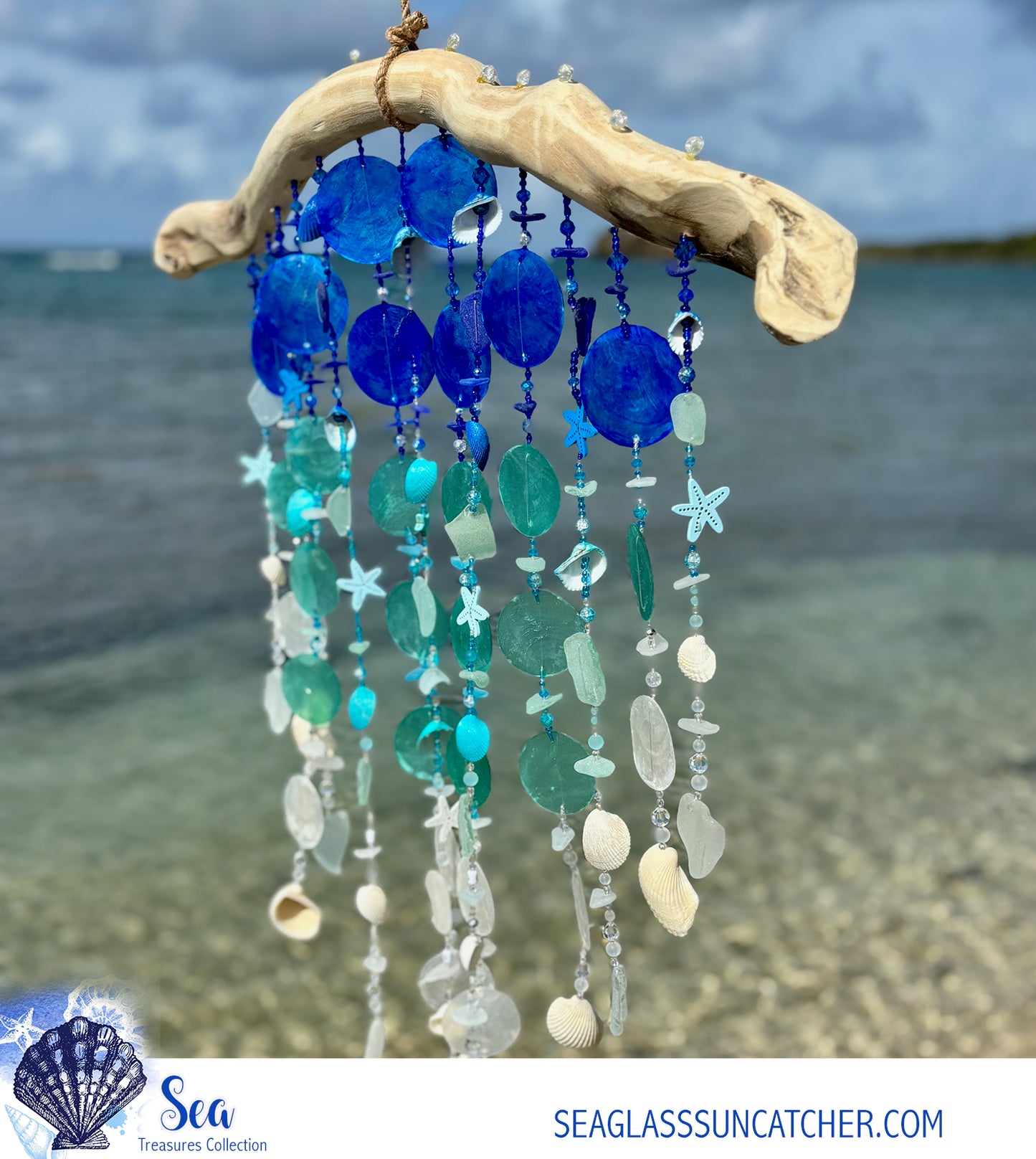 Decorative wind chime with blue and white beads on a beach