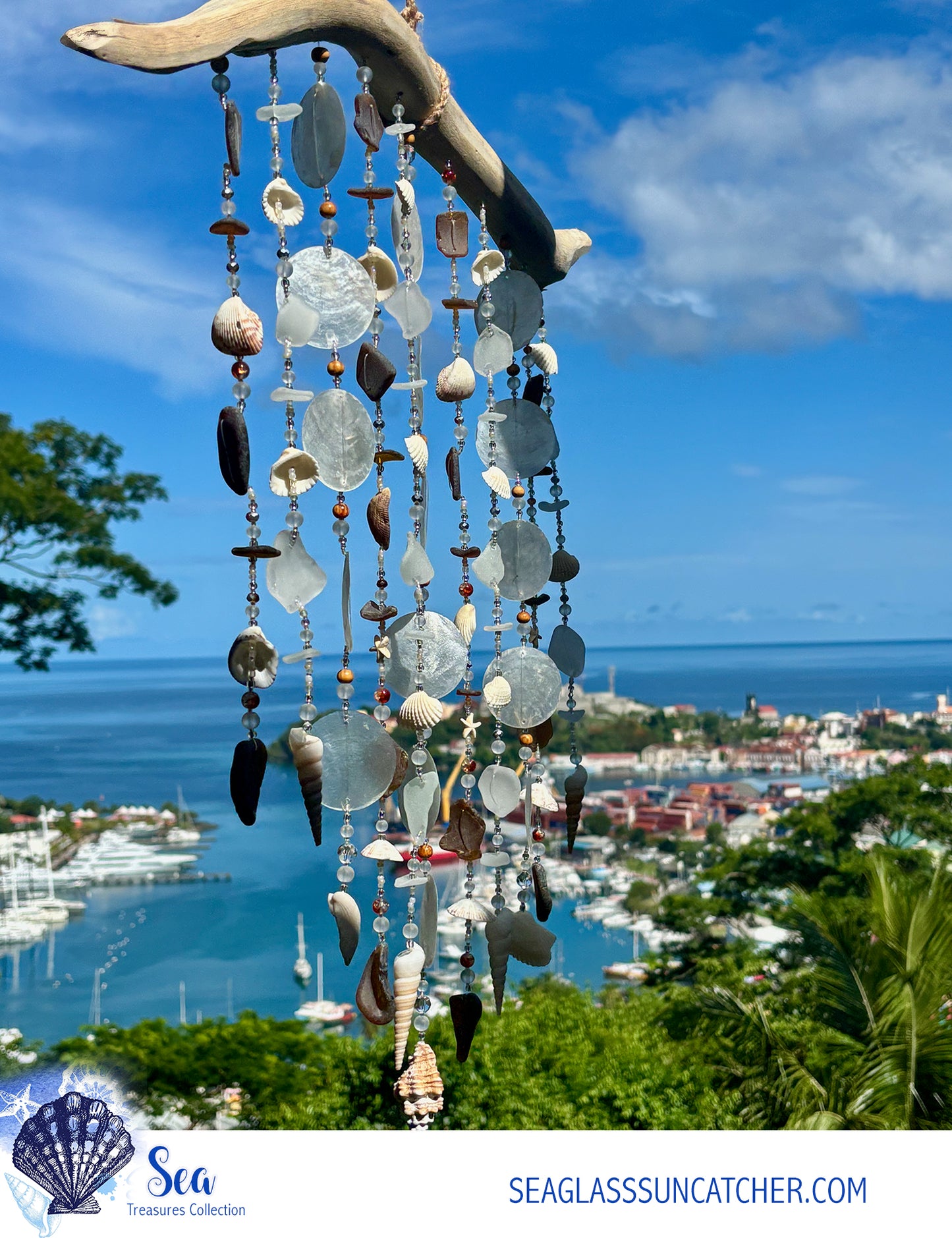 Seaglass sun catcher with a scenic view of a harbor and cityscape in the background.