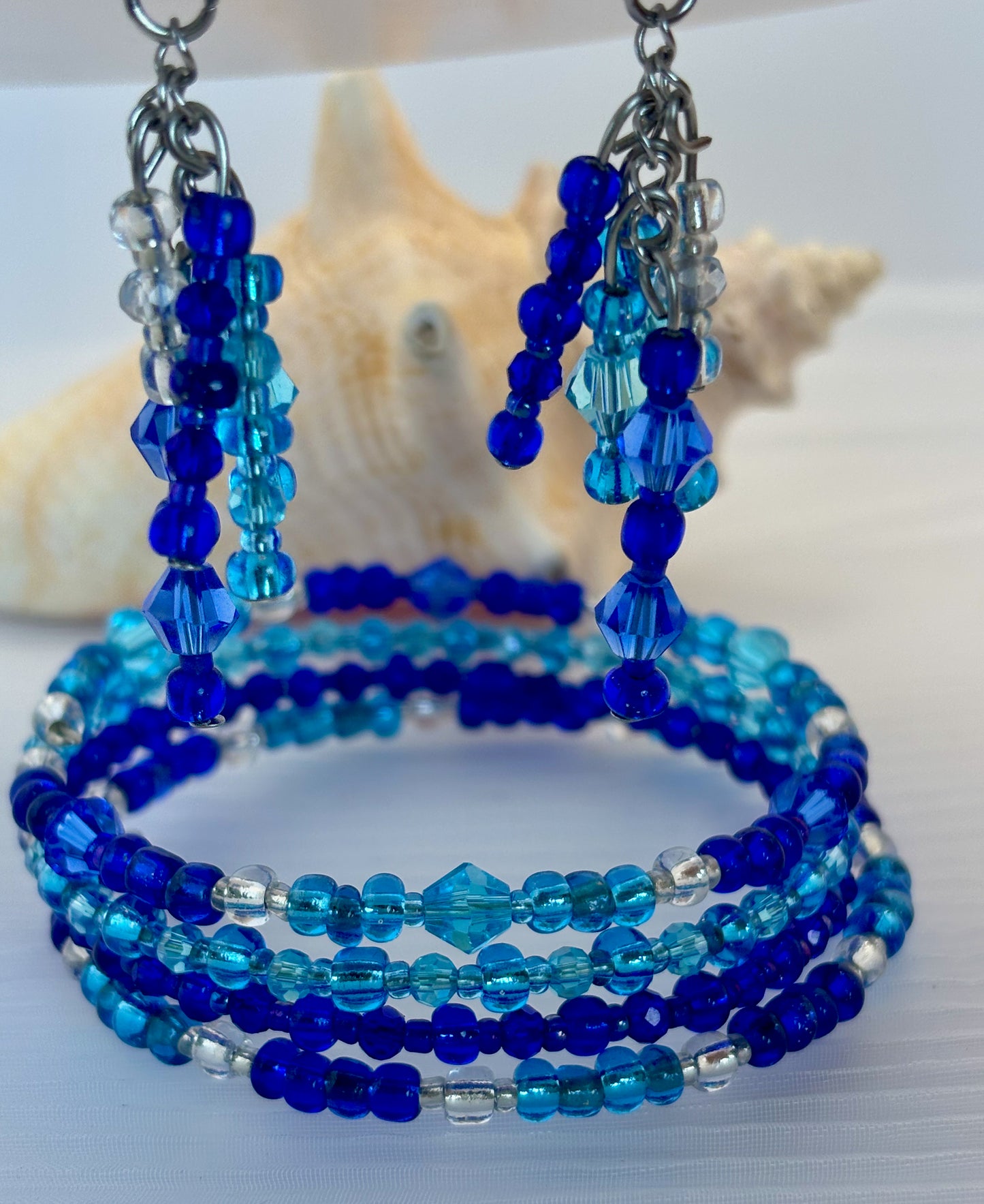 Set of blue beaded bracelets and earrings.