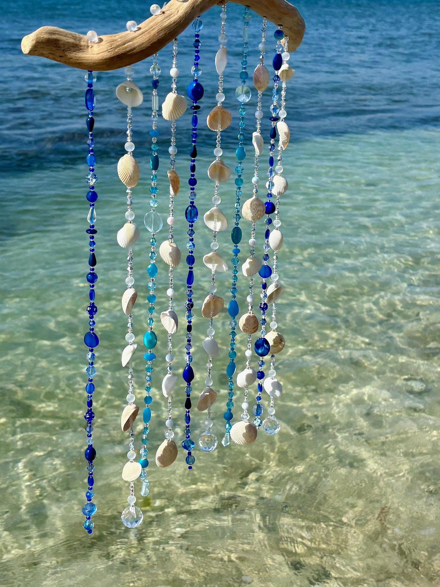 Tropical wind chime and sun catcher with sea shells, glass beads, and crystals on Driftwood. Gift for Beach Lovers