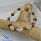 Beaded bracelet with natural wood piece, 'Sea Treasures Collection' branding.