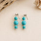Handmade Caribbean Blue drop earrings featuring turquoise beads and stainless steel findings, handcrafted in Grenada.