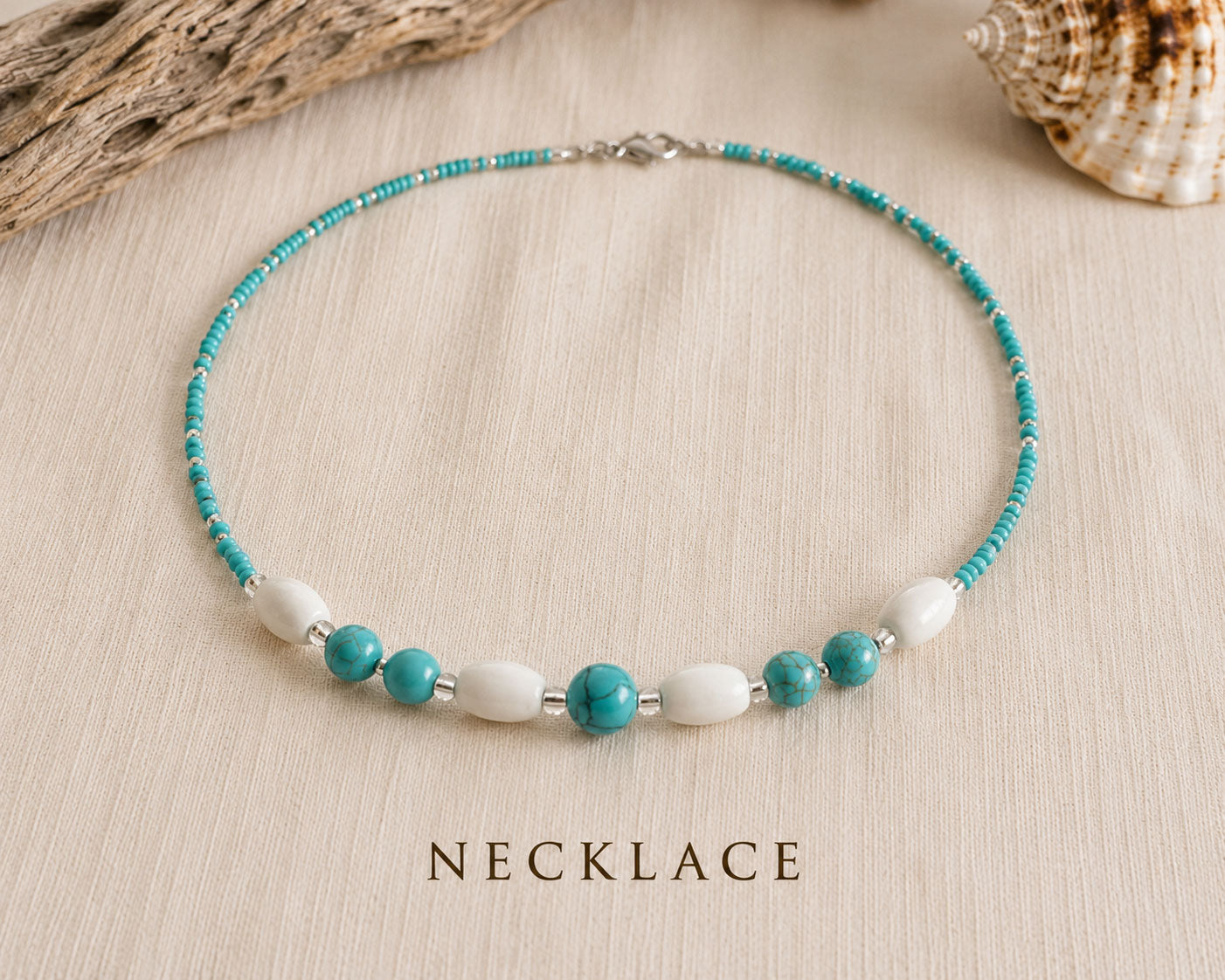 Handmade Caribbean Blue necklace featuring turquoise beads, white wooden beads and stainless steel accents inspired by the Caribbean Sea.
