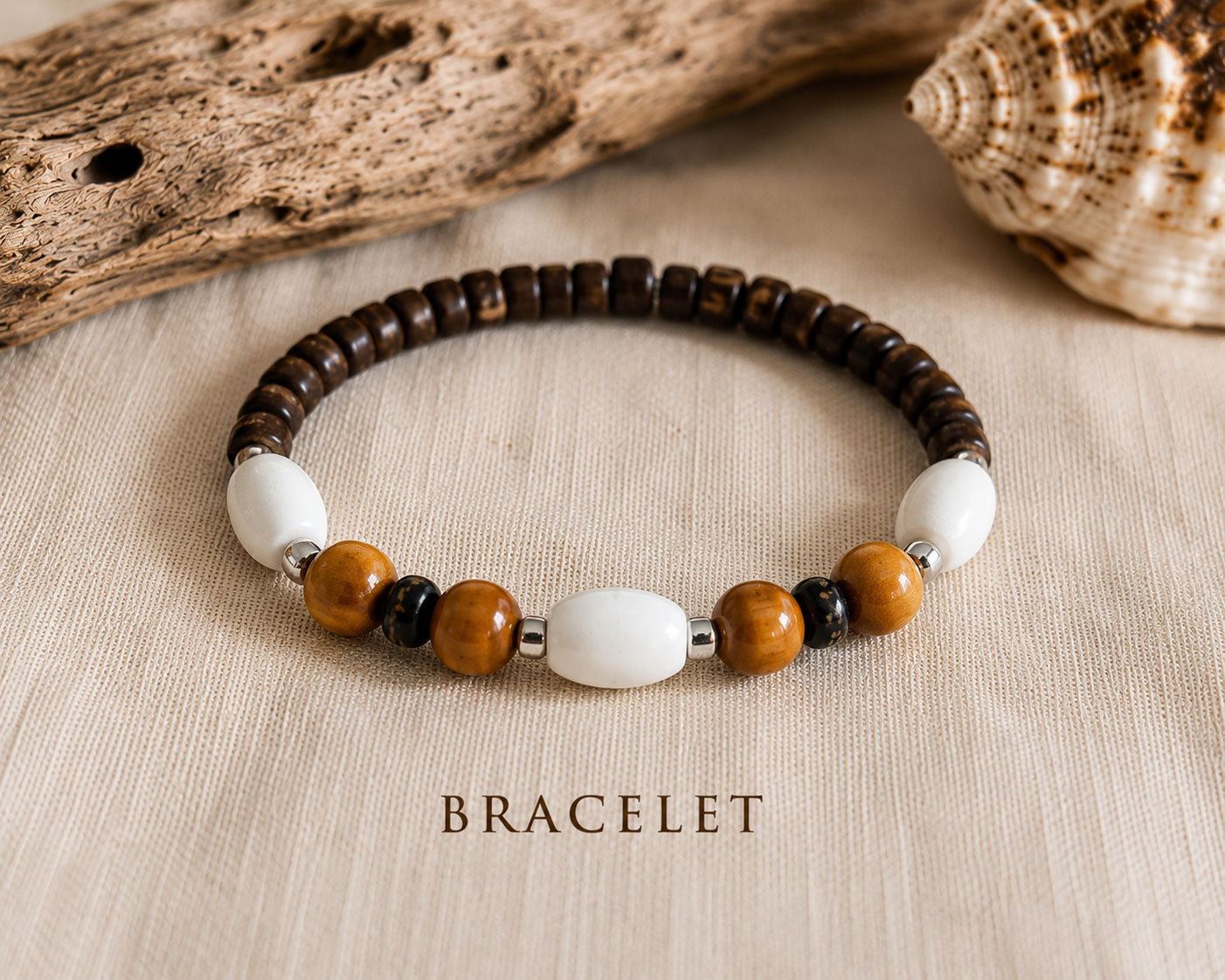 Close-up of the Island Drift handmade bracelet featuring coconut beads, natural wood and white accent beads.