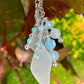 Keychain with sea glass and beads against a leafy background