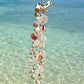 Side profile of the Seashell Serenity Driftwood Wind Chime showing handcrafted shell details.