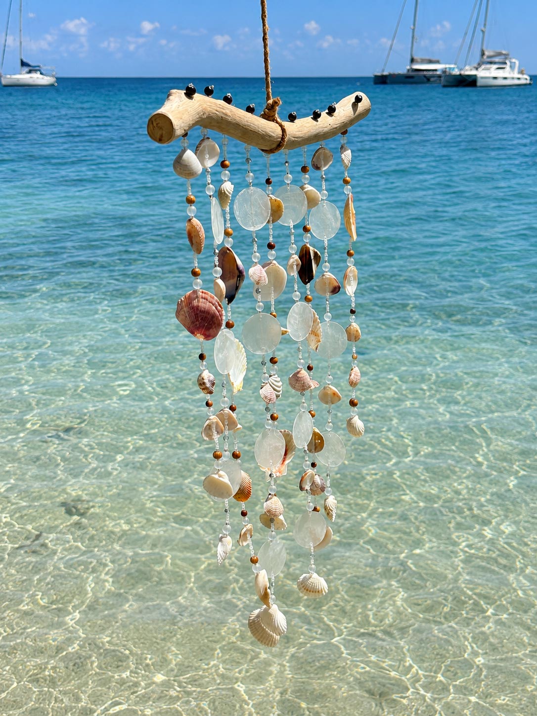 Side profile of the Seashell Serenity Driftwood Wind Chime showing handcrafted shell details.