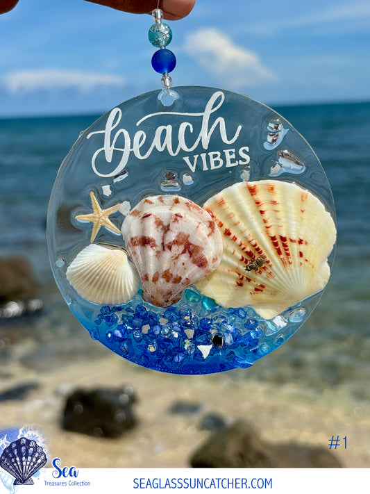 Seaglass suncatcher with shells and starfish against a beach background