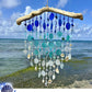 Seaglass and shell wind chime with ocean view
