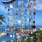 Decorative seaglass suncatcher with a scenic ocean view in the background