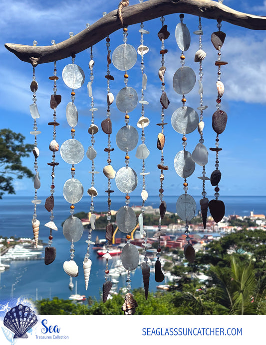 Decorative seaglass suncatcher with a scenic ocean view in the background