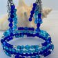 Set of blue beaded bracelets and earrings.