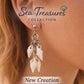 Woman wearing Delicate Whispering Shell Earrings inspired by the Caribbean Sea