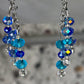 Blue beaded earrings on a blurred background
