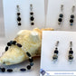 Black beaded jewelry set with a shell and card displaying 'Sea Glass Treasures Collection' branding.