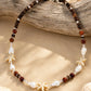 Island Star shell necklace with coconut wood beads, natural shells and stainless steel clasp.