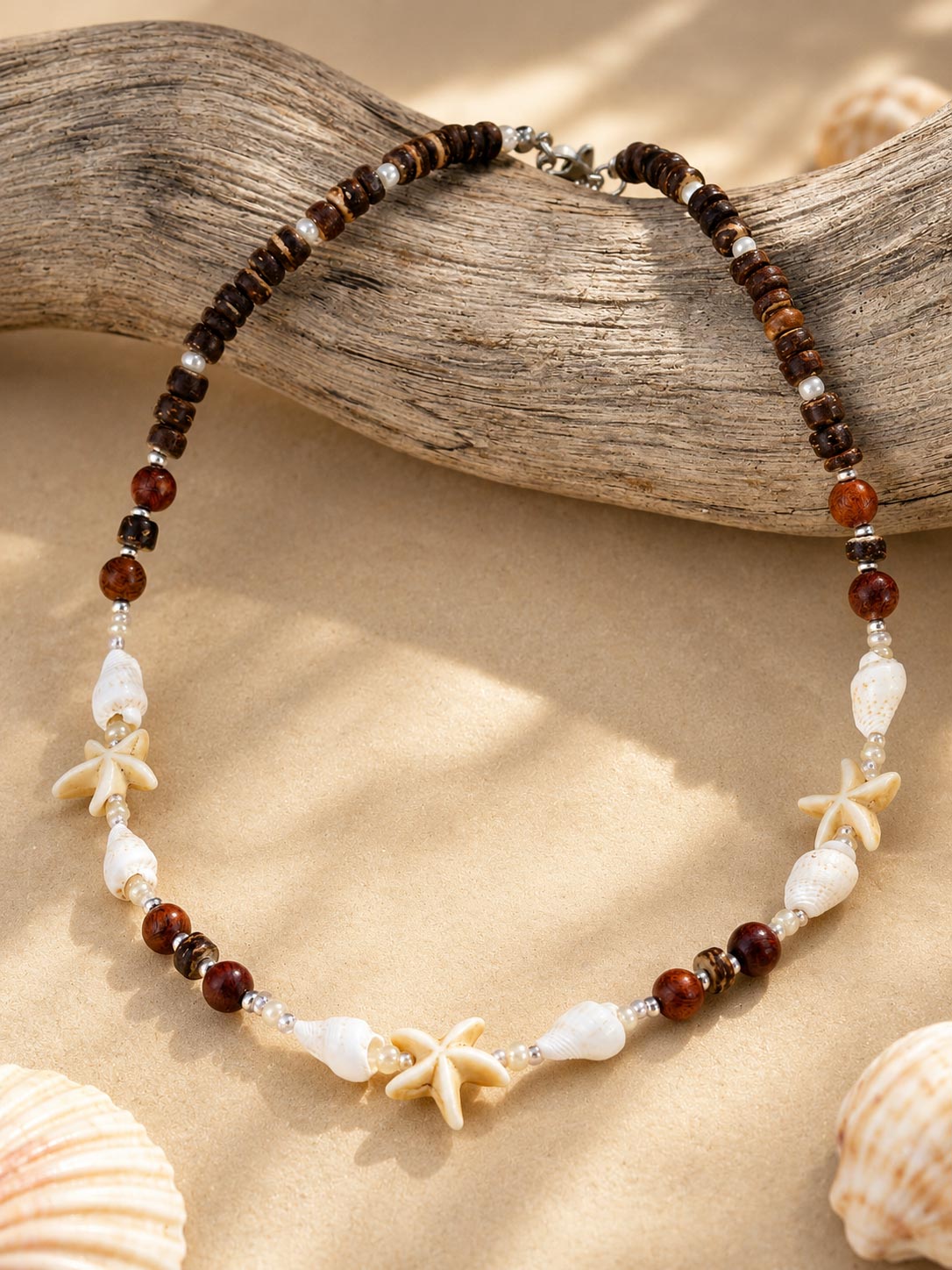 Island Star shell necklace with coconut wood beads, natural shells and stainless steel clasp.