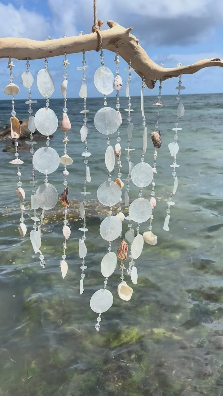 Video of white tropical beach windchime