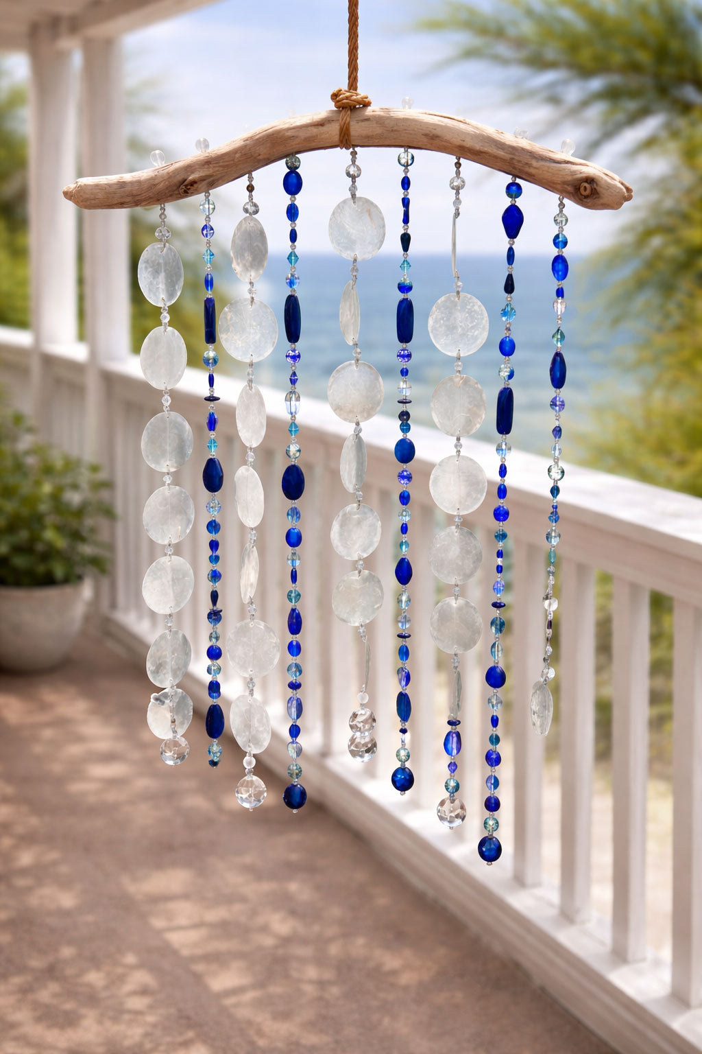 Tropical Wind Chime & Sun Catcher with Capiz shells, glass beads, crystals on Driftwood.