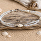 Handmade Whispering Shell Bracelet featuring natural shells, seed beads and stainless steel findings
