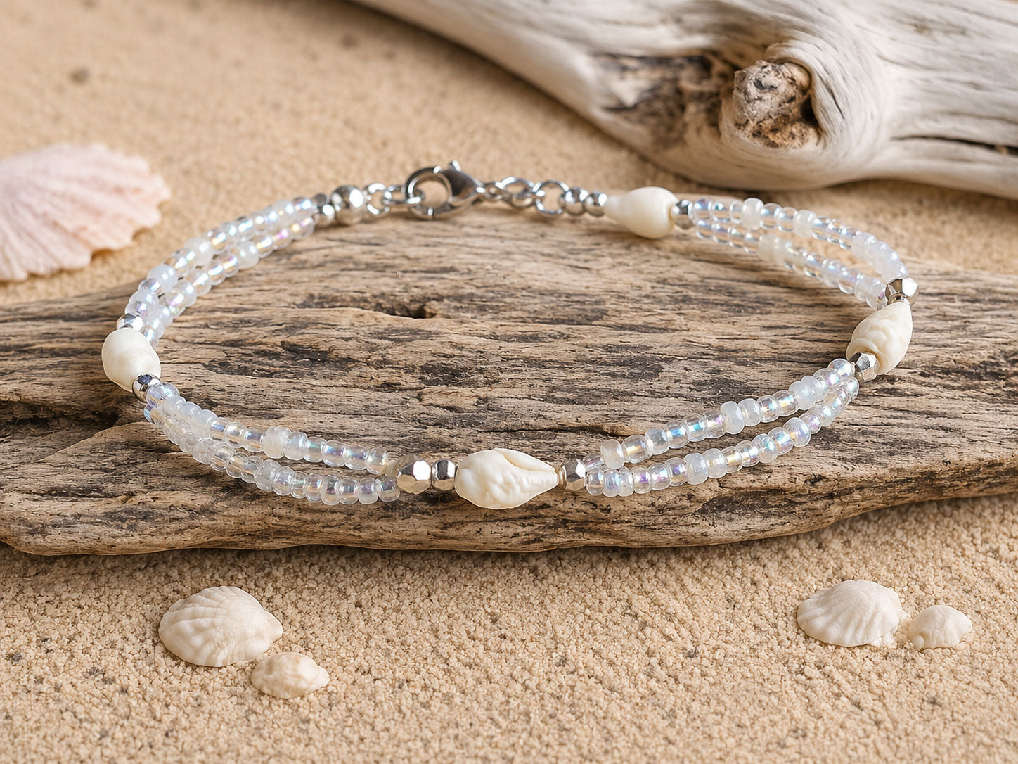 Handmade Whispering Shell Bracelet featuring natural shells, seed beads and stainless steel findings
